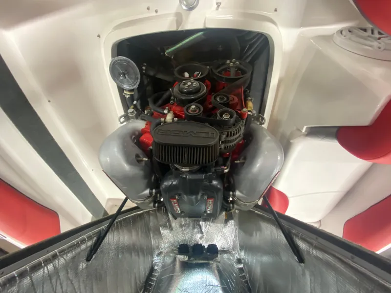 Slide: The Image of 2011 MasterCraft X14 engine compartment with visible components and red accents. - 34