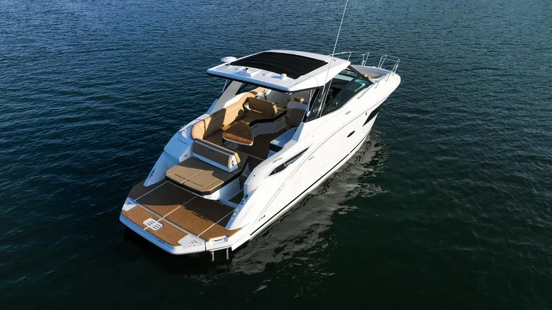 Slide: The Image of 2024 Sea Ray Sundancer 320 yacht cruising on open water. - 2