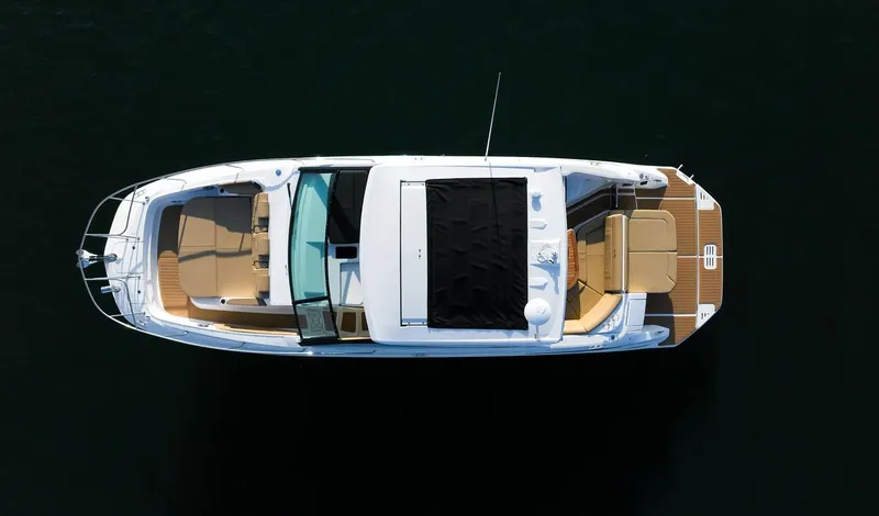 Slide: The Image of 2024 Sea Ray Sundancer 320 boat, aerial view, sleek design, spacious deck, luxury yacht. - 4