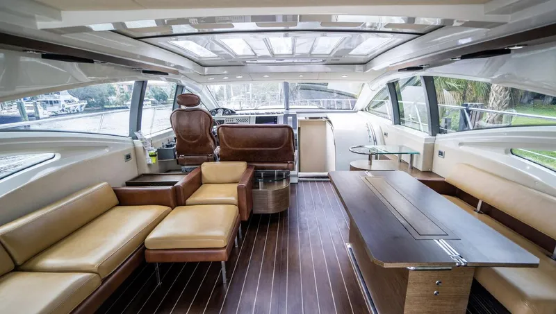 Slide: The Image of Luxurious interior of a 2005 Azimut 68S yacht with leather seating and wooden flooring. - 2