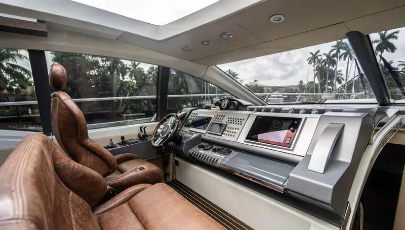 Slide: The Image of Luxurious interior of 2005 Azimut 68S yacht with leather seating and modern dashboard. - 4