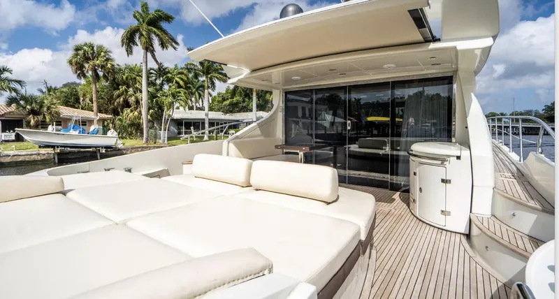 Slide: The Image of Luxurious 2005 Azimut 68S yacht deck with plush seating and sleek design. - 7