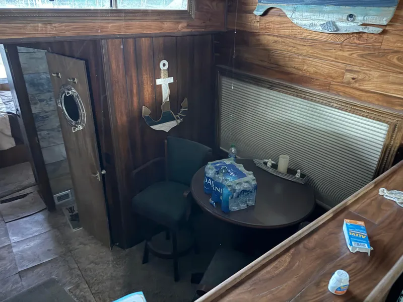 Slide: The Image of Interior of 1980 Harbor Master 47 boat with wood paneling and nautical decor. - 15