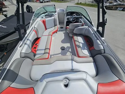 Slide: The Image of 2023 Sanger V237 SX boat interior with red and gray seating, open layout. - 11
