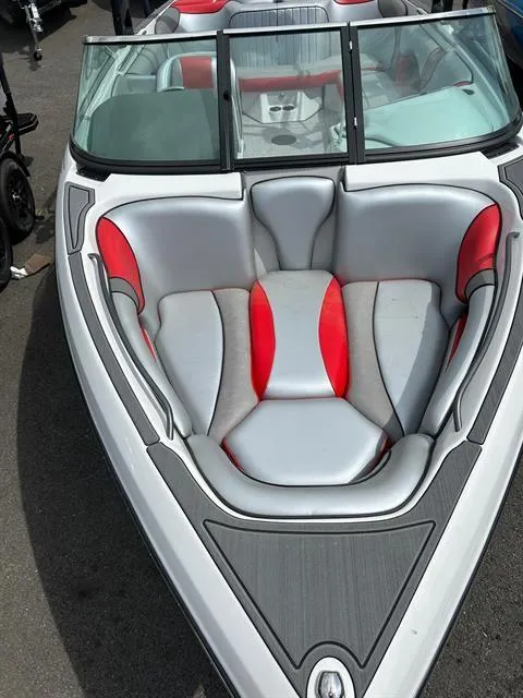 Slide: The Image of 2023 Sanger V237 SX boat with sleek gray and red interior design. - 14