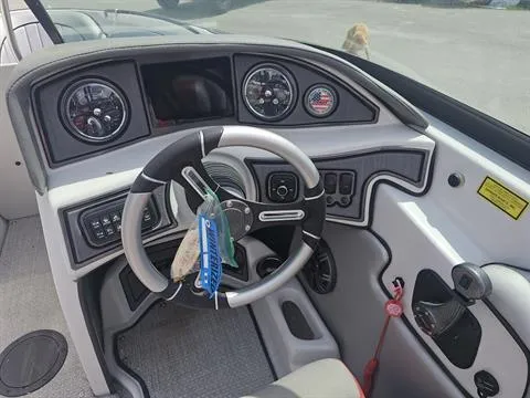 Slide: The Image of 2023 Sanger V237 SX boat dashboard with steering wheel and instrument panel. - 15