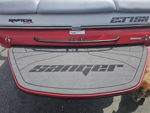 Slide: The Image of 2023 Sanger V237 SX boat rear view with logo and swim platform. - 19