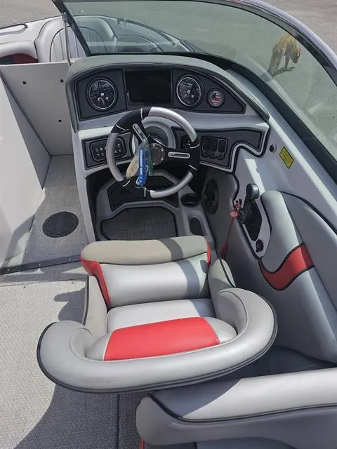 Slide: The Image of 2023 Sanger V237 SX boat interior with modern dashboard and steering wheel. - 22