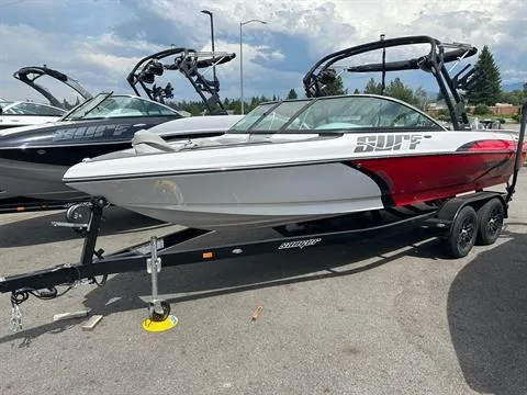 Slide: The Image of 2023 Sanger V237 SX boat on trailer, white and red design, parked outdoors. - 3