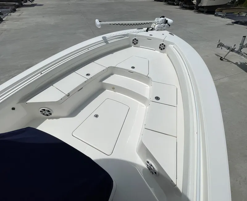 Slide: The Image of 2021 Regulator 26XO boat deck with spacious seating and storage compartments. - 22