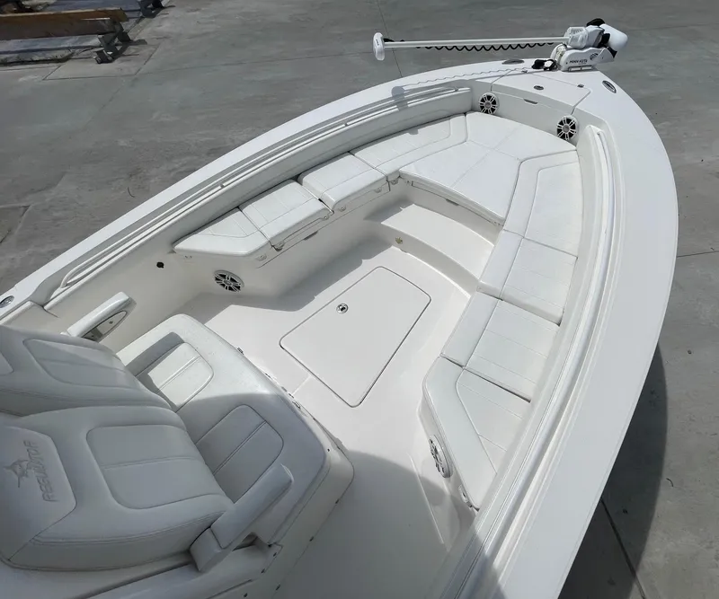 Slide: The Image of 2021 Regulator 26XO boat with spacious white seating and modern design. - 23