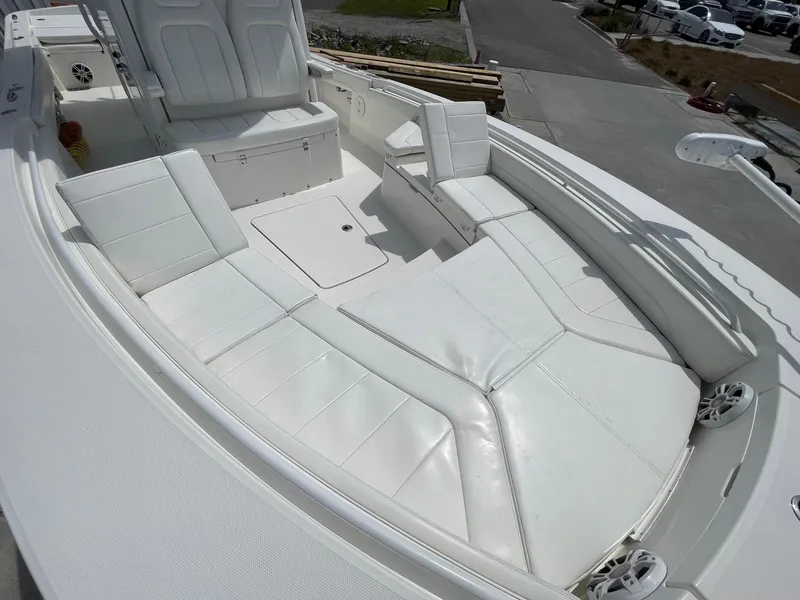 Slide: The Image of 2021 Regulator 26XO boat with spacious white seating area and modern design. - 24