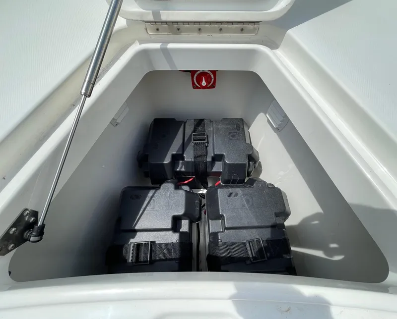 Slide: The Image of Battery compartment of 2021 Regulator 26XO boat, featuring secure battery storage. - 40