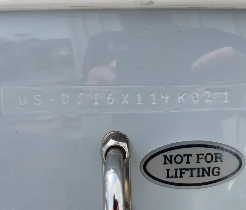 Slide: The Image of 2021 Regulator 26XO boat with hull identification number and "Not for Lifting" label. - 43