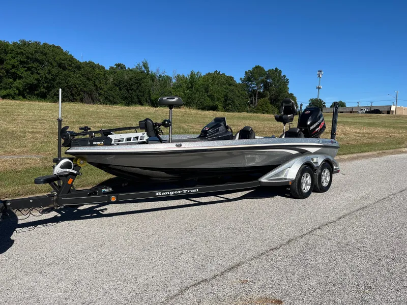 Slide: The Image of 2016 Ranger Z520 boat on trailer, parked on roadside with grassy background. - 35