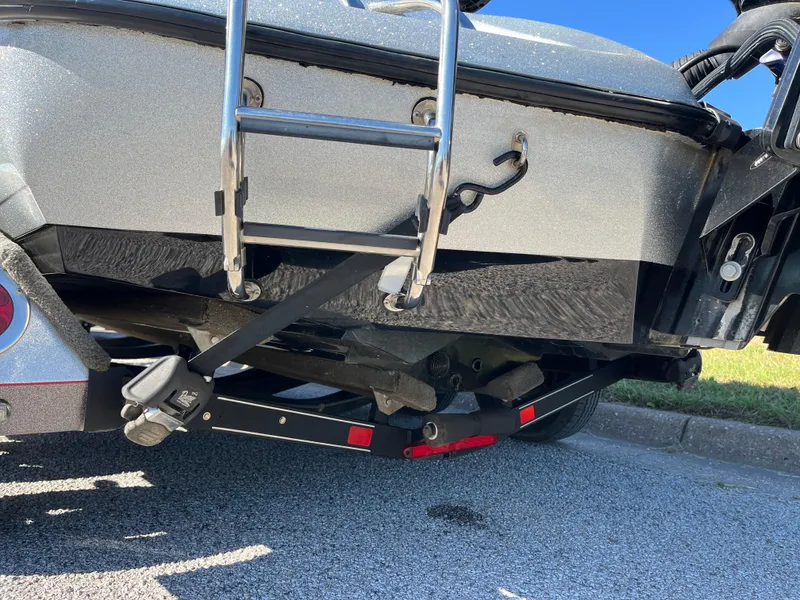 Slide: The Image of 2016 Ranger Z520 boat trailer with ladder and secure straps on pavement. - 43