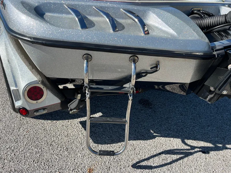 Slide: The Image of 2016 Ranger Z520 boat with a rear boarding ladder on a sunny day. - 44