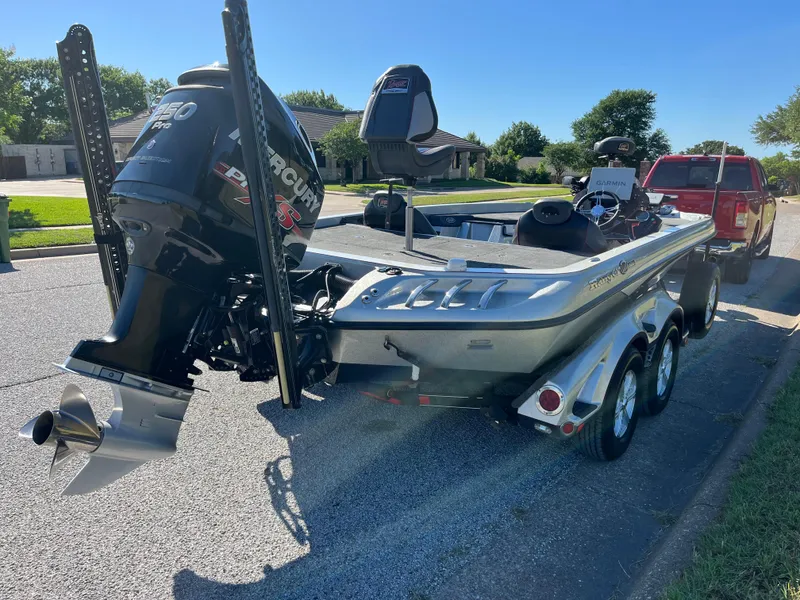 Slide: The Image of 2016 Ranger Z520 boat with Mercury engine on a trailer, parked on a suburban street. - 49