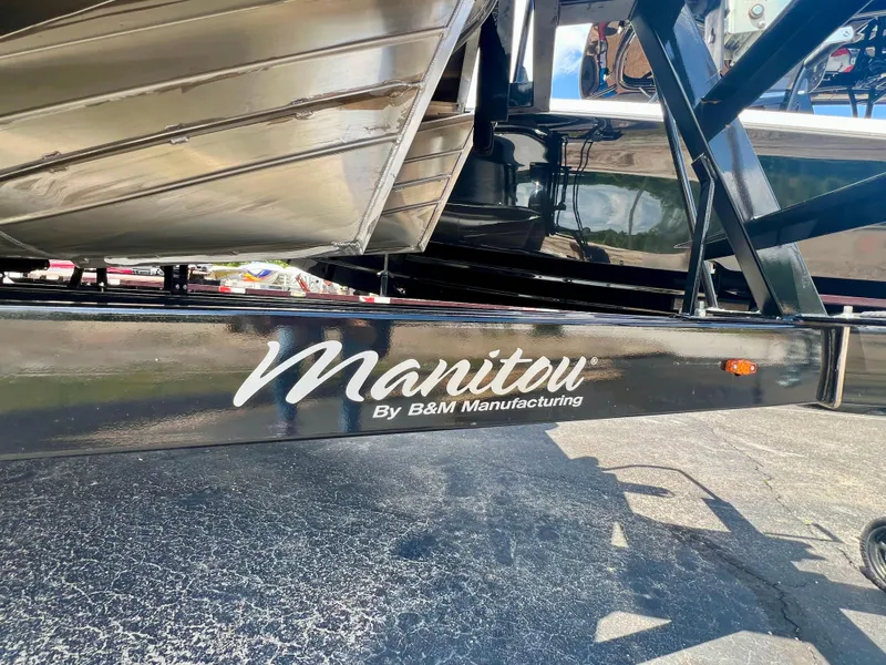 Slide: The Image of 2022 Manitou 25 LX SHP DE boat trailer by B&M Manufacturing, close-up view. - 33