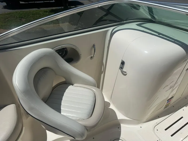 Slide: The Image of 2007 Bryant 240BR boat interior with white seating and sleek design. - 6