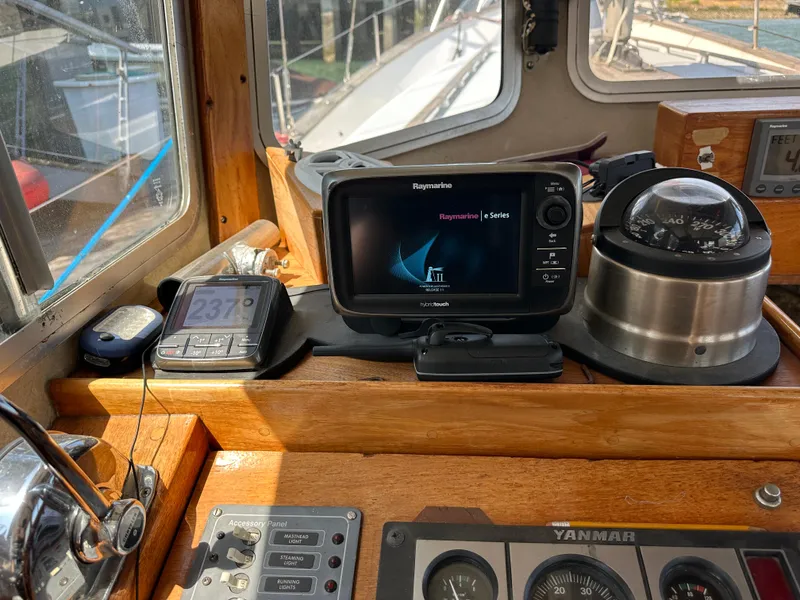 Slide: The Image of Pilothouse of 1985 Fisher 34 Pilothouse Ketch with navigation equipment and compass. - 16