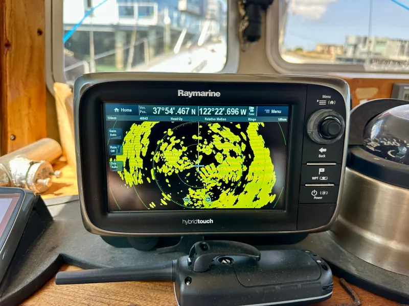 Slide: The Image of Raymarine radar display on 1985 Fisher 34 Pilothouse Ketch, showing navigation data. - 18
