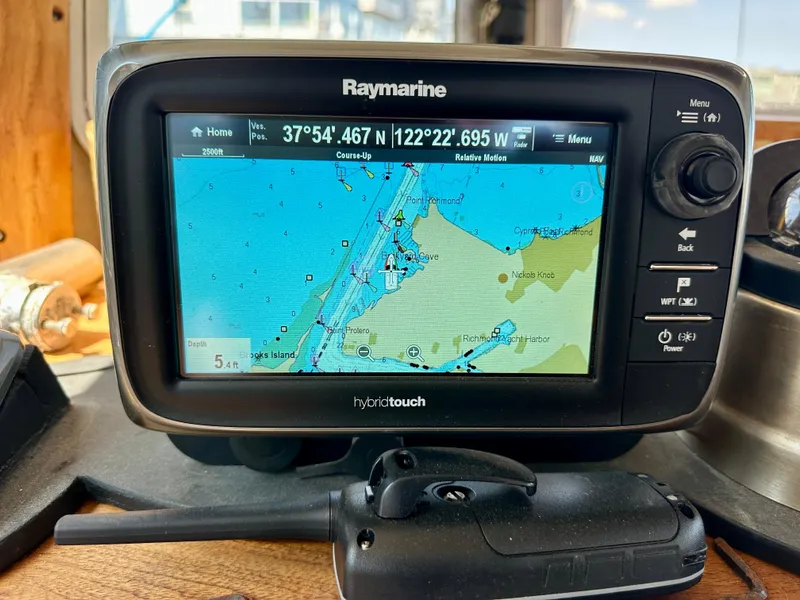 Slide: The Image of Raymarine GPS display on 1985 Fisher 34 Pilothouse Ketch, showing nautical map and coordinates. - 19
