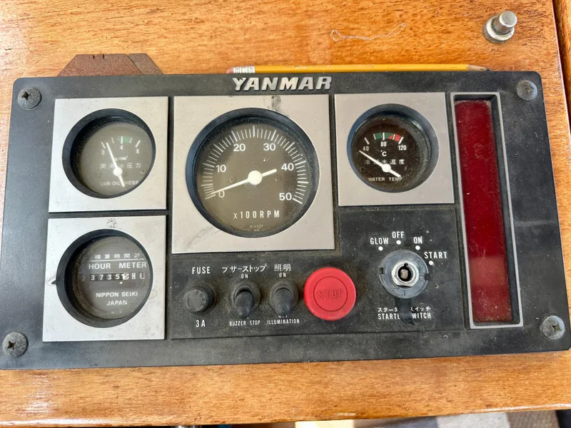 Slide: The Image of Control panel of a 1985 Fisher 34 Pilothouse Ketch with Yanmar engine gauges. - 22