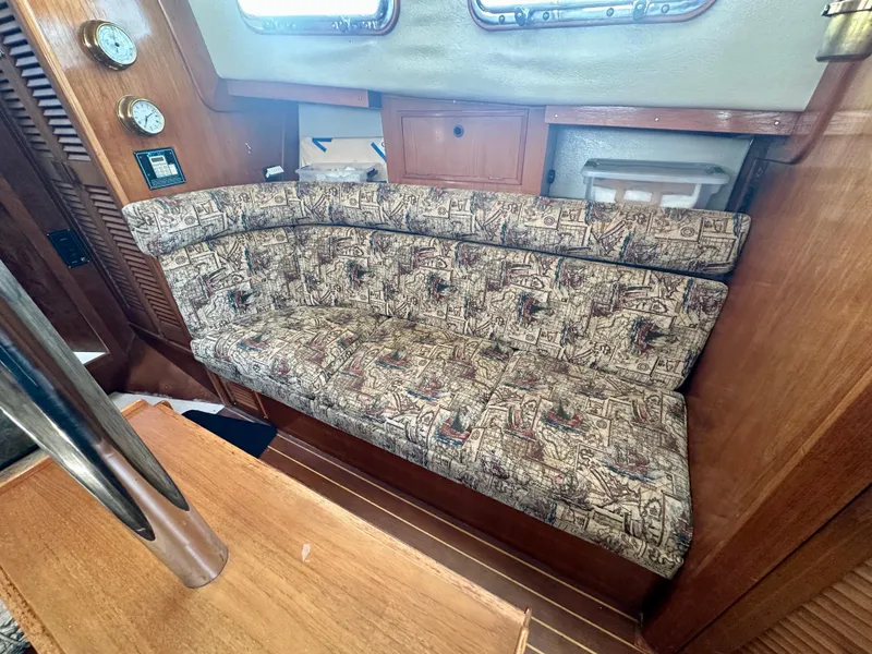 Slide: The Image of Interior of 1985 Fisher 34 Pilothouse Ketch with patterned cushioned seating. - 36