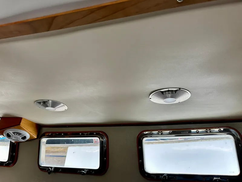 Slide: The Image of Interior ceiling of 1985 Fisher 34 Pilothouse Ketch with windows and ventilation. - 51