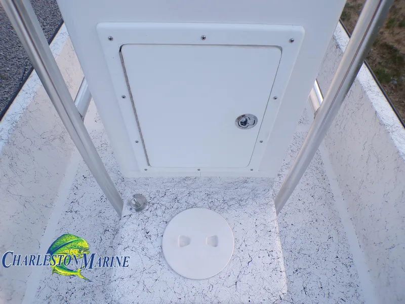 Slide: The Image of Panga 22 boat deck with storage hatch, 2023 model, Charleston Marine logo visible. - 15