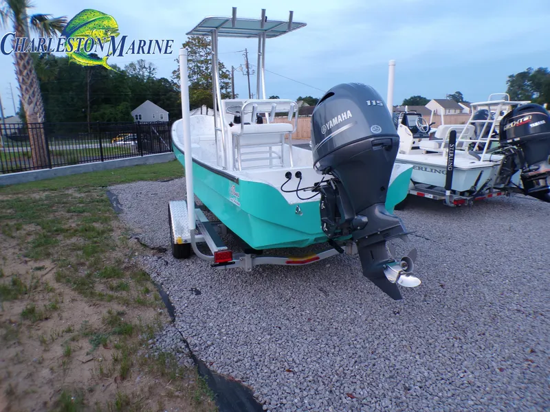 Slide: The Image of 2023 Panga 22 boat with Yamaha engine on gravel lot at Charleston Marine. - 2