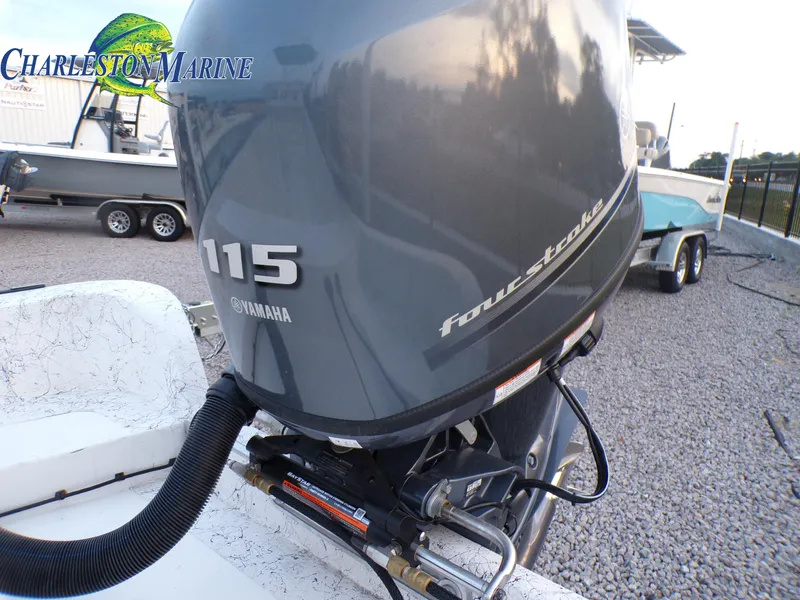 Slide: The Image of Yamaha 115 four-stroke outboard engine on 2023 Panga 22 boat at Charleston Marine. - 21