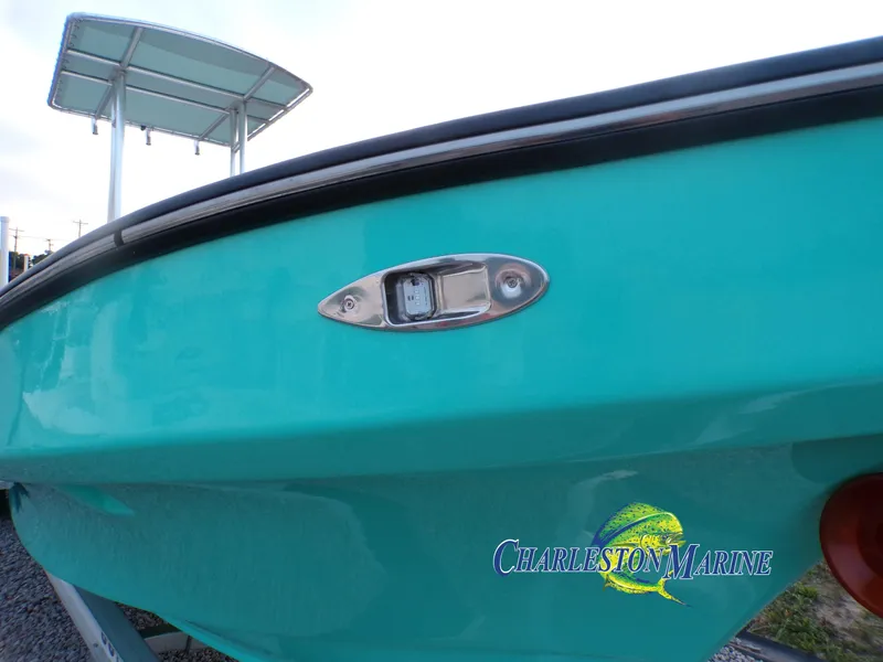 Slide: The Image of Turquoise 2023 Panga 22 boat with Charleston Marine logo, featuring sleek design and modern detailing. - 24