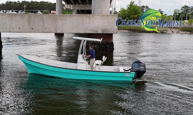 Slide: The Image of 2023 Panga 22 boat cruising under a bridge near Charleston Marine. - 4