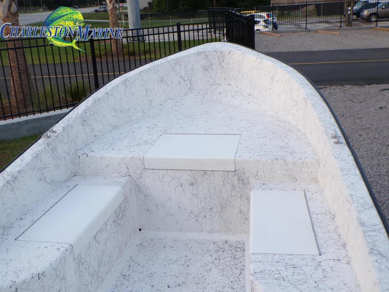 Slide: The Image of 2023 Panga 22 boat interior with white seating, displayed at Charleston Marine. - 5