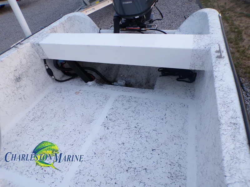 Slide: The Image of 2023 Panga 22 boat interior with Charleston Marine logo, featuring a clean, textured deck. - 8