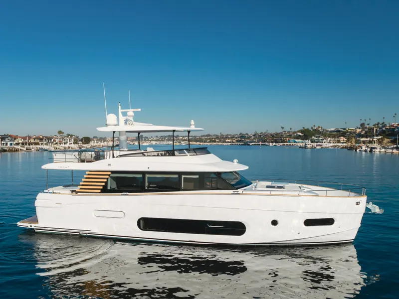 Slide: The Image of 2023 Azimut Magellano 66 yacht cruising on a sunny day in a calm harbor. - 0