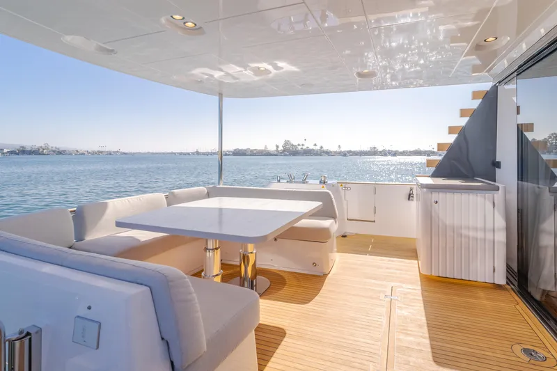 Slide: The Image of Luxurious deck of 2023 Azimut Magellano 66 yacht with seating and ocean view. - 25