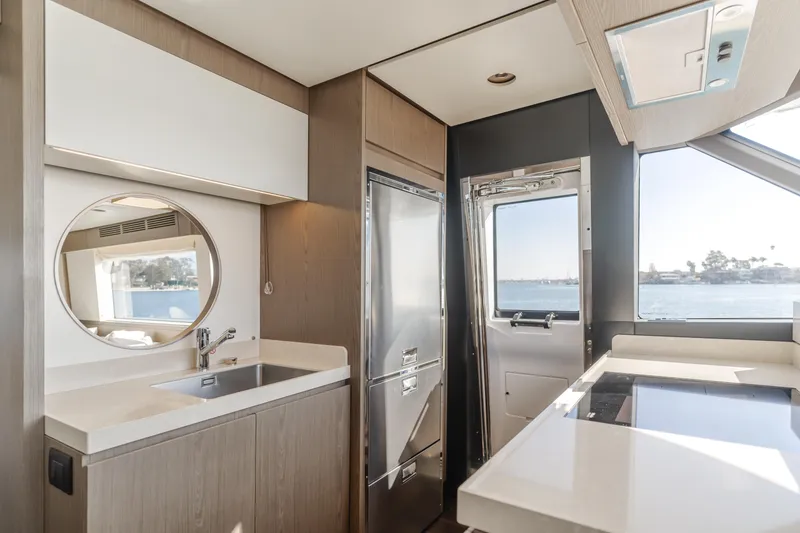 Slide: The Image of Modern kitchen interior of 2023 Azimut Magellano 66 yacht with sleek design and ocean view. - 34