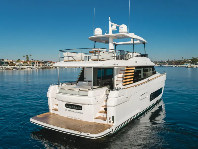 Slide: The Image of Azimut Magellano 66 yacht, 2023 model, cruising on calm waters under clear blue skies. - 4