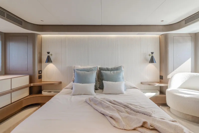 Slide: The Image of Luxurious bedroom interior of 2023 Azimut Magellano 66 yacht, featuring modern design and cozy ambiance. - 42