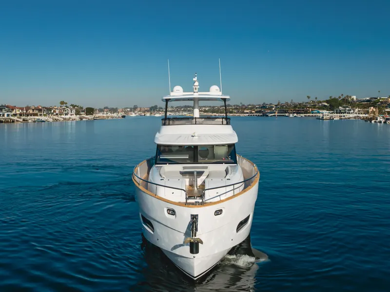 Slide: The Image of 2023 Azimut Magellano 66 yacht cruising on a calm blue sea. - 5