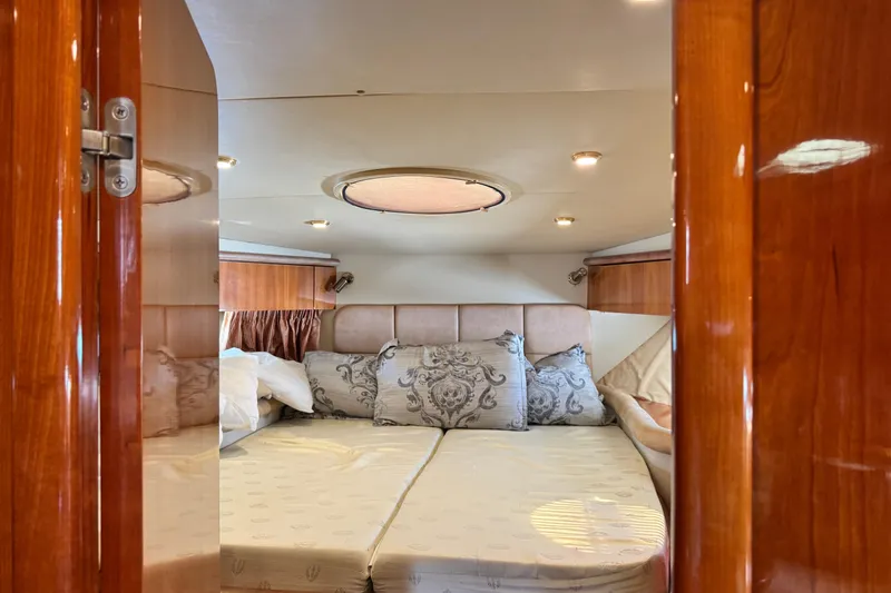 Slide: The Image of Luxurious cabin interior of 2000 Sunseeker Predator 56 yacht with elegant bedding. - 14