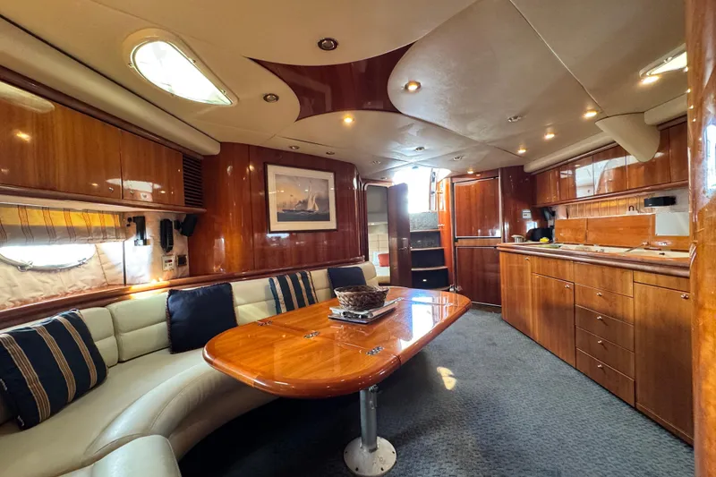 Slide: The Image of Luxurious interior of a 2000 Sunseeker Predator 56 yacht with elegant wood finishes. - 15