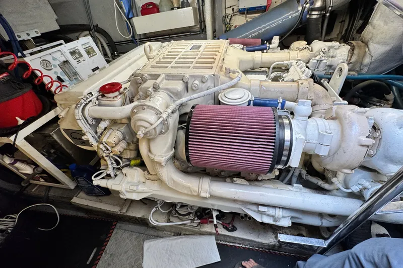 Slide: The Image of Engine room of a 2000 Sunseeker Predator 56 yacht, showcasing detailed machinery. - 18