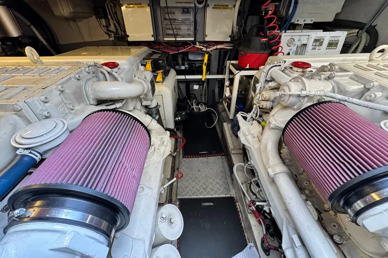 Slide: The Image of Engine room of a 2000 Sunseeker Predator 56 yacht, showcasing dual engines and components. - 19