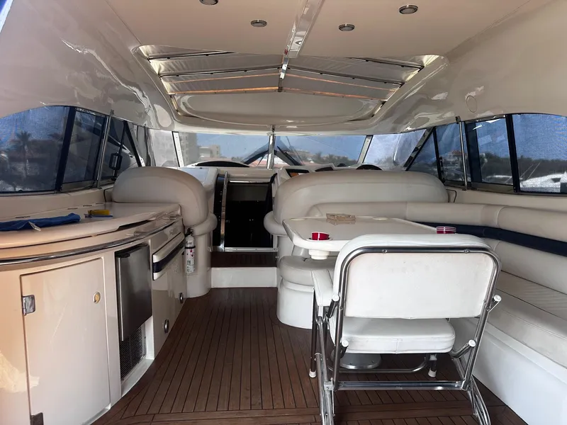 Slide: The Image of Helm of 2000 Sunseeker Predator 56 yacht with navigation screens and controls. - 6