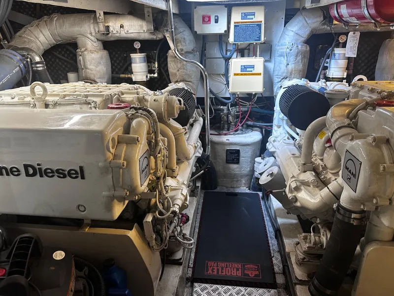 Slide: The Image of Luxurious interior of a 2000 Sunseeker Predator 56 yacht with polished wood and plush seating. - 9