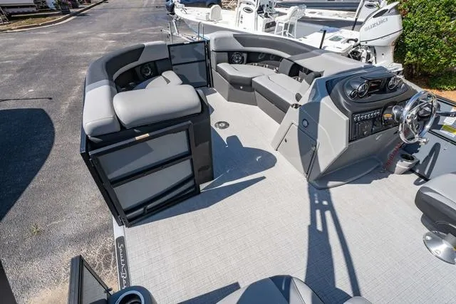 Slide: The Image of 2024 South Bay S224 UL 3.0 pontoon boat interior with modern seating and helm. - 12